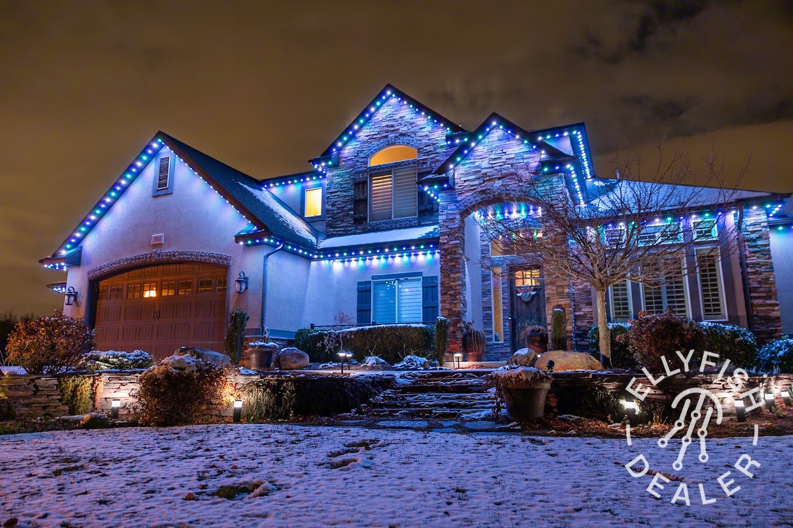 Landscaped yard with evergreens and hardscape providing structure during winter in Ohio