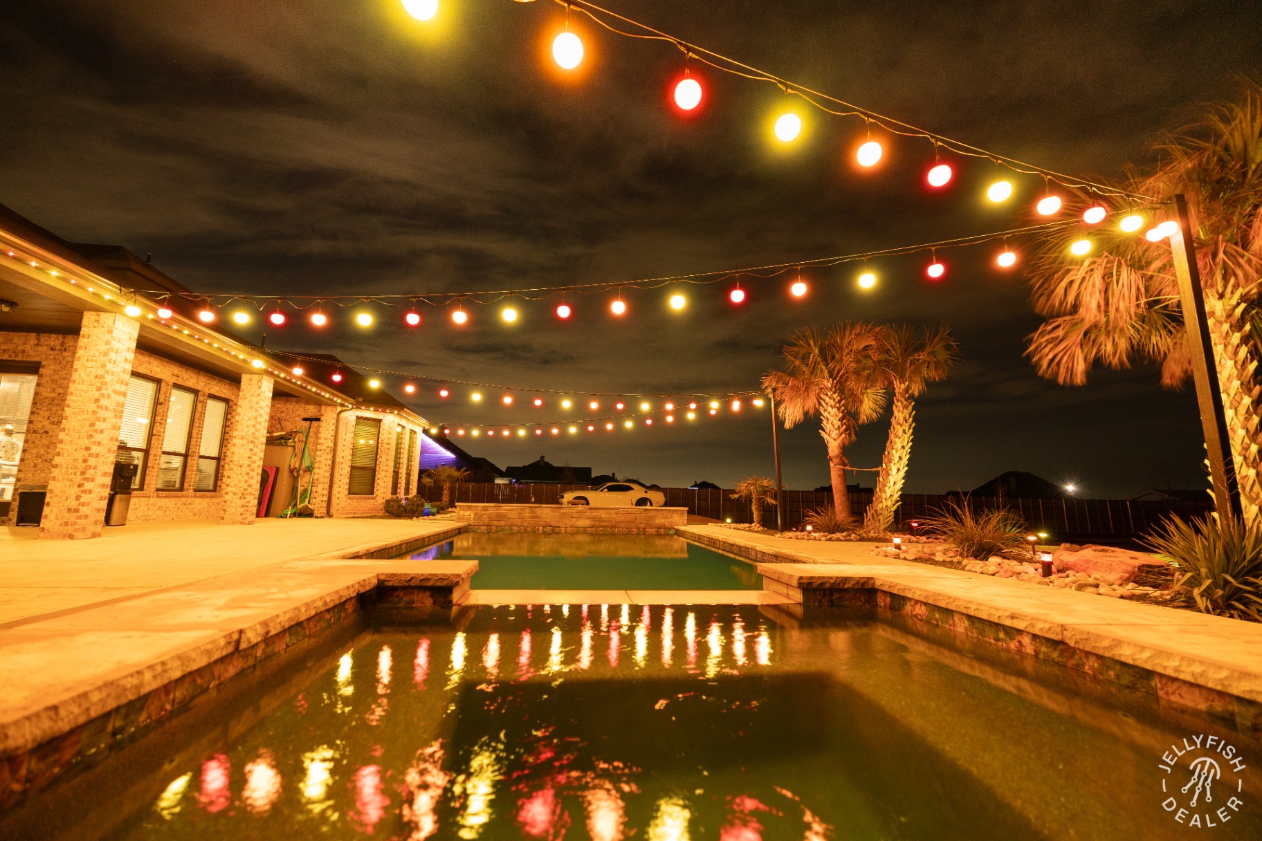 Warm string glow over the pool