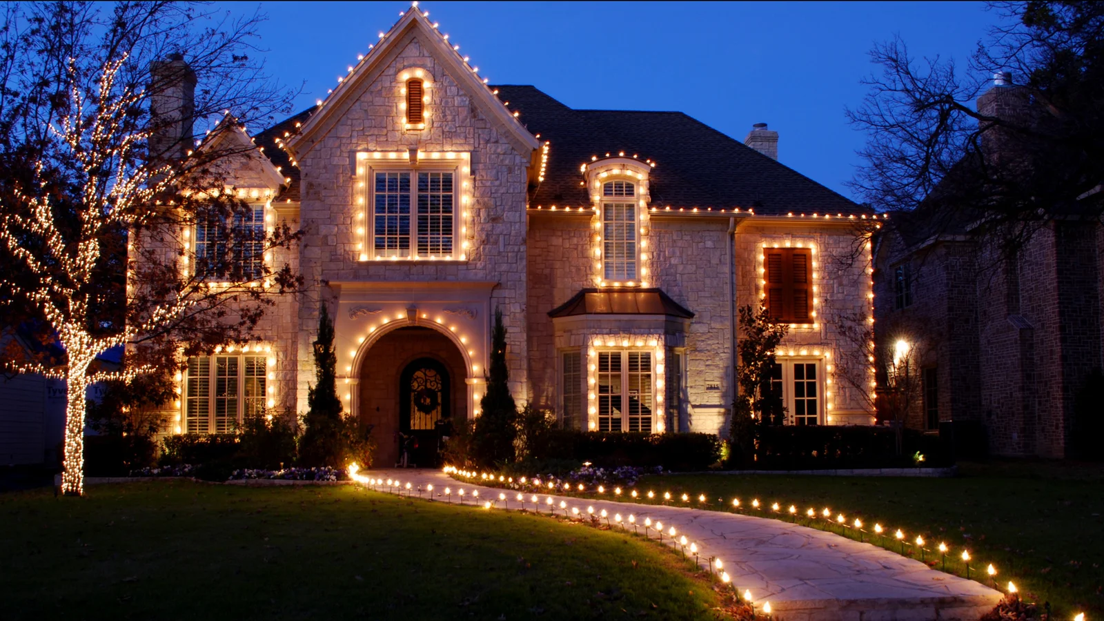 Traditional holiday lighting on a decorated home