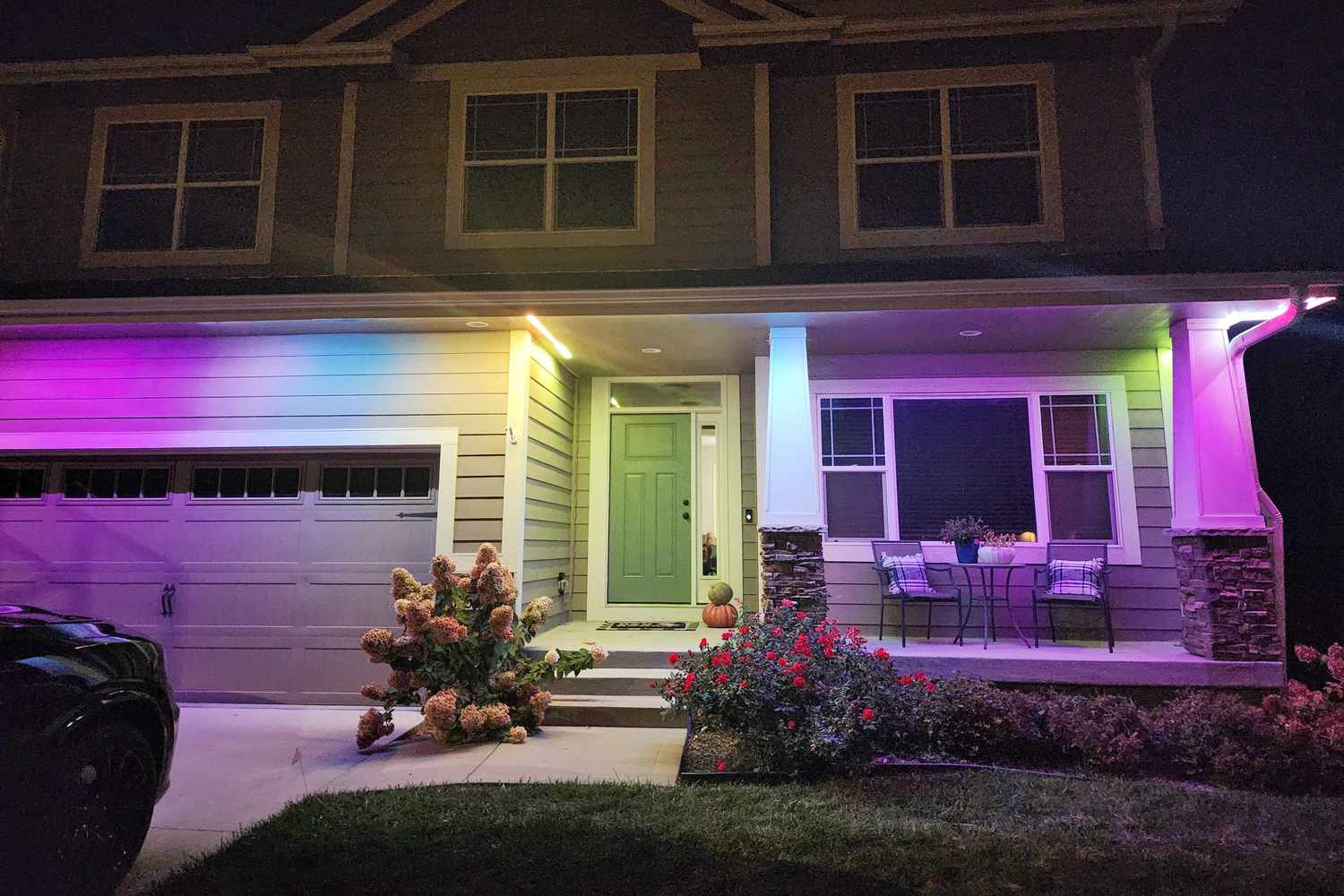 Home at dusk with warm permanent LED roofline lighting